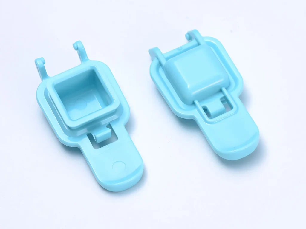 Two blue plastic clasps