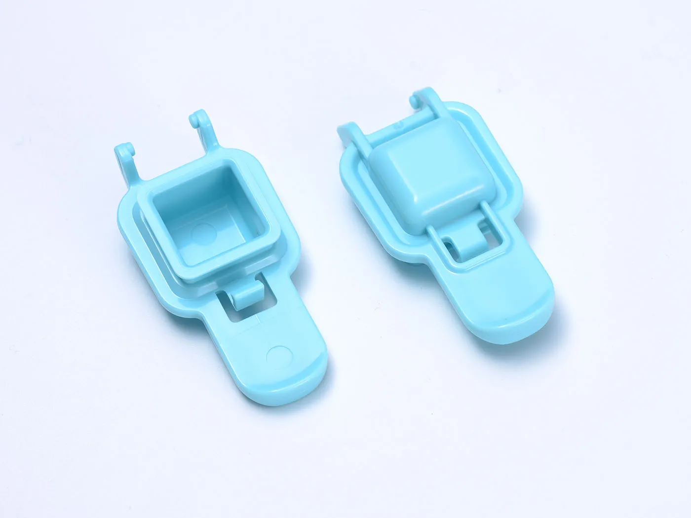 Two blue plastic clips