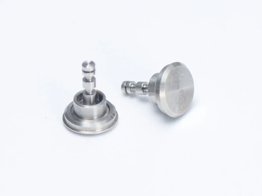 Two metal machine parts