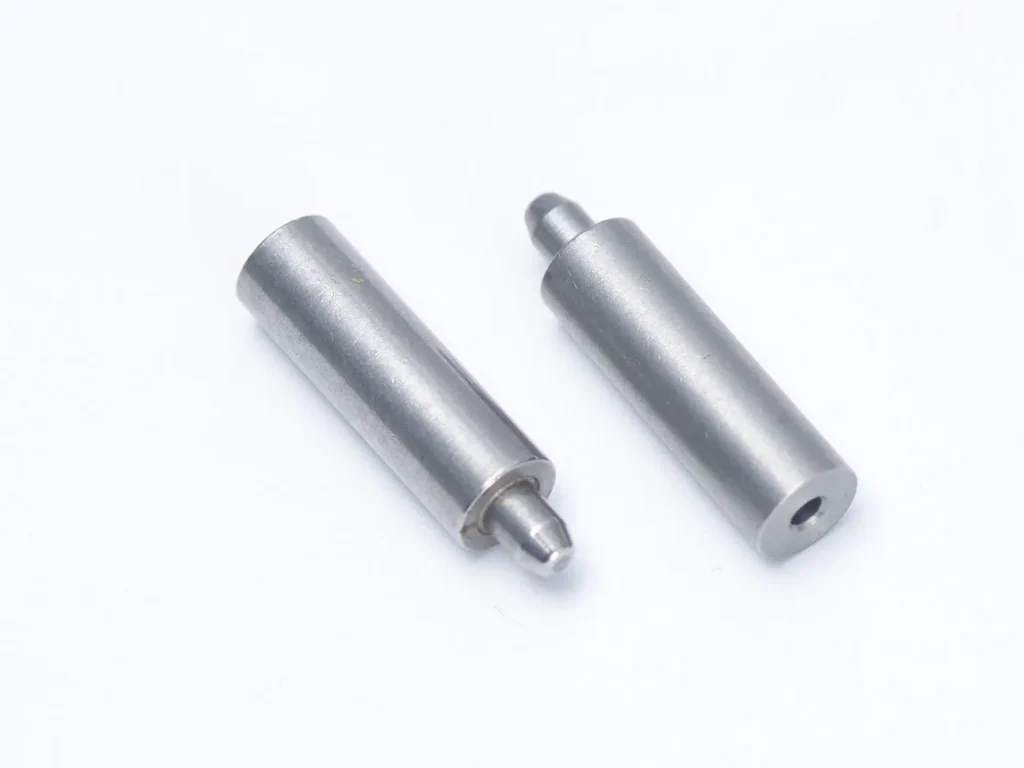 Metal pins on white background