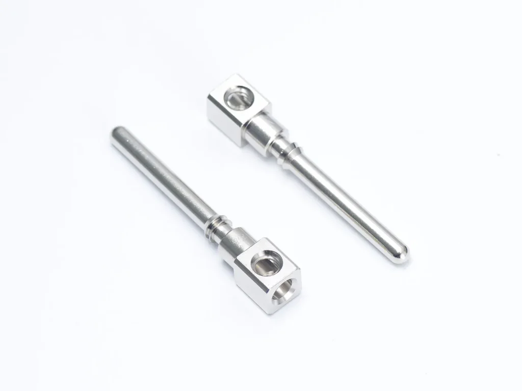 Metal pins on white background